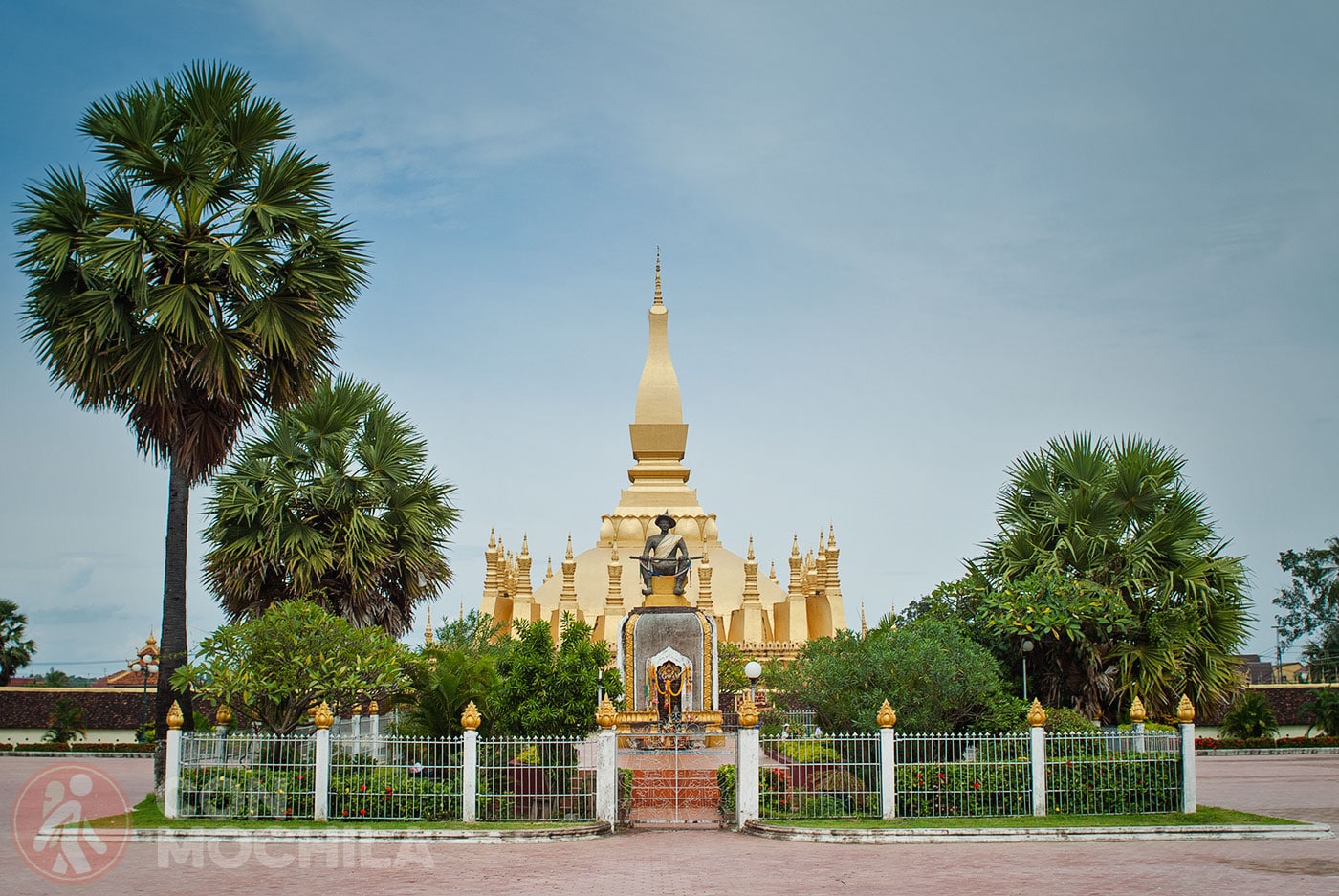 Statue of King Setthatthirat with Pha That Luang in the Background
