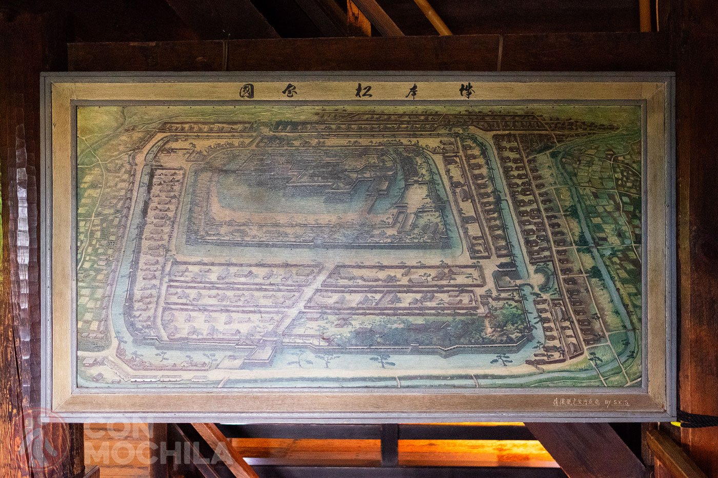 A board with a map of the castle in its time