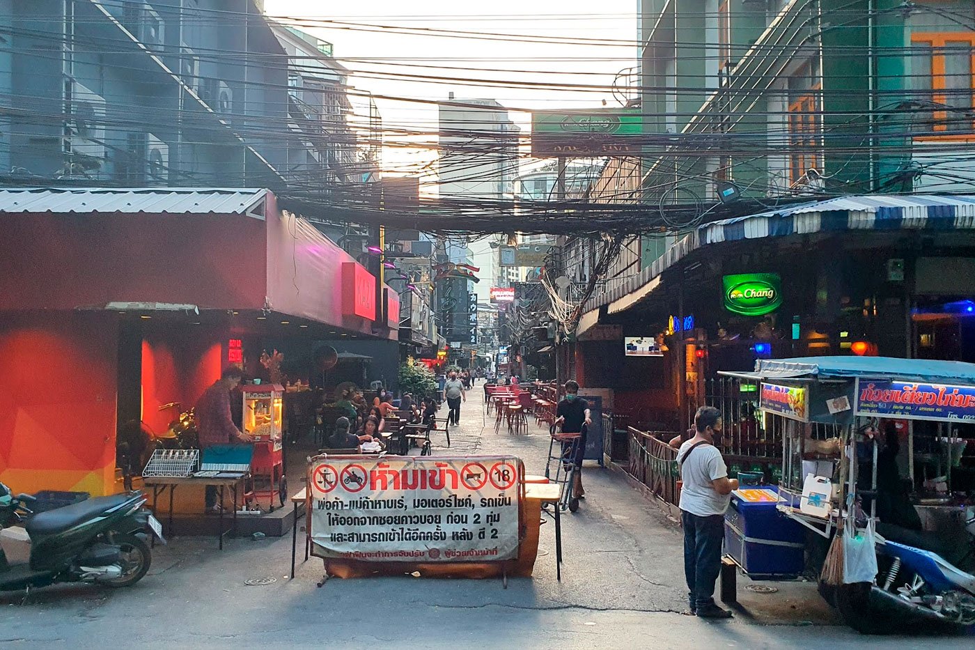 During the day, Soi Cowboy looks like any other place. It's at night that it transforms.