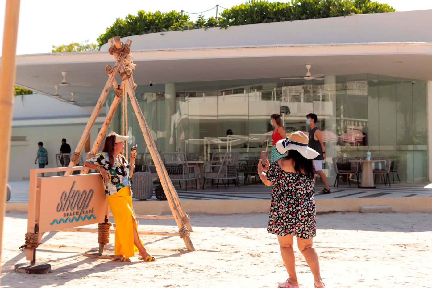 Thai tourists at a beach-themed cafe.