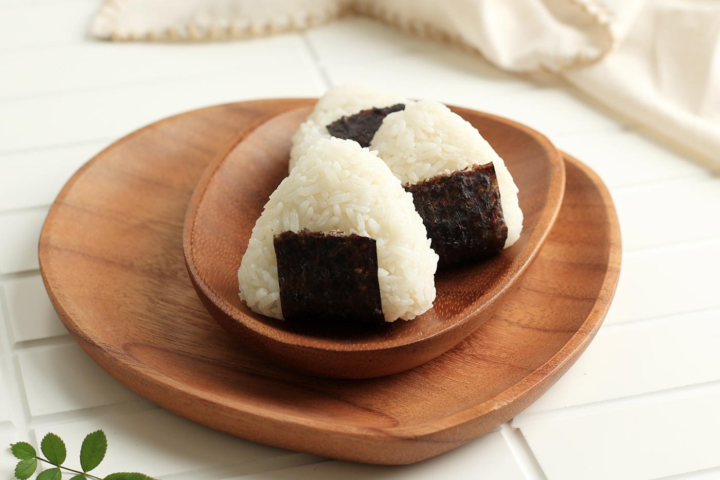 The most classic and basic onigiri: a handful of white rice with a strip of nori (dried seaweed) to hold it better